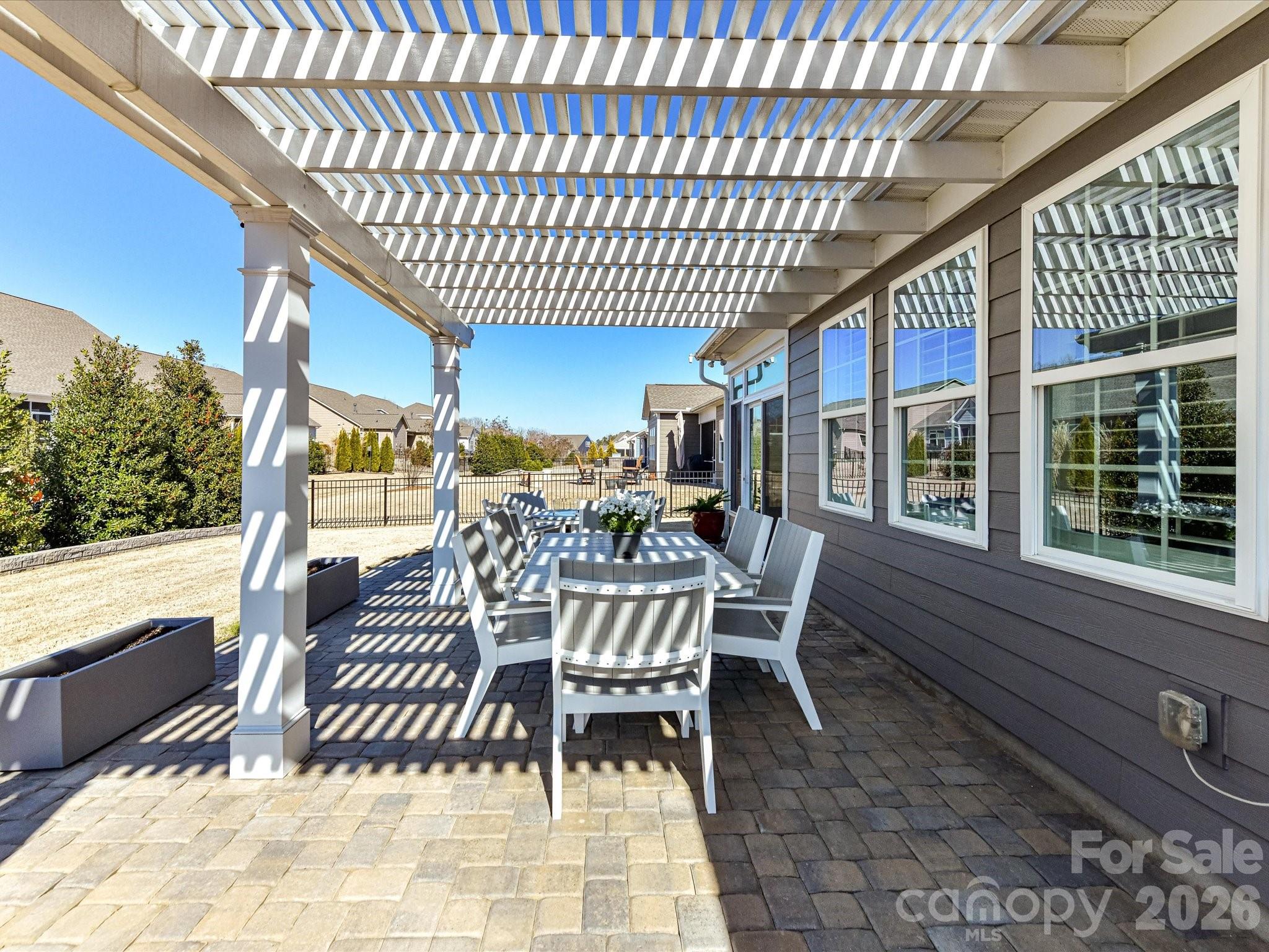 3355 Oliver Stanley Trail Lancaster, SC 29720 - Photo 34 of 48 a view of a patio with a dining table and chairs with wooden floor