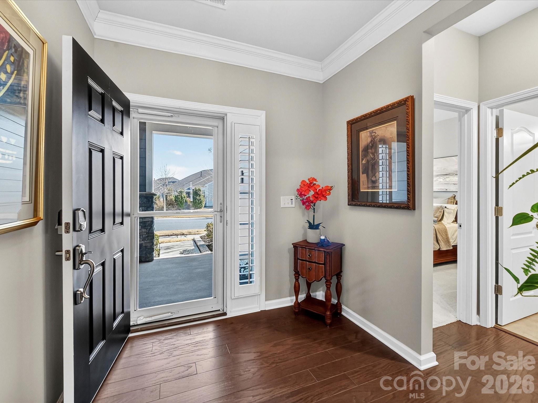 3355 Oliver Stanley Trail Lancaster, SC 29720 - Photo 5 of 48 a view of a livingroom with wooden floor and a hallway