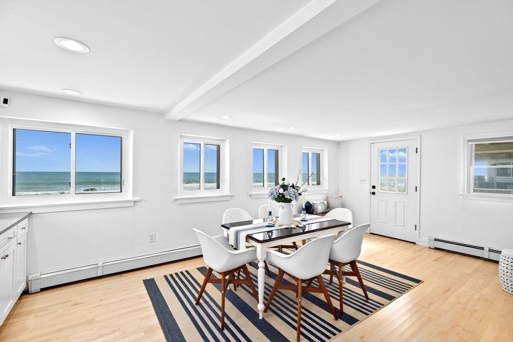37 Rebecca Road Scituate, MA 02066 - Photo 12 of 18 a dining room with wooden floor and a window