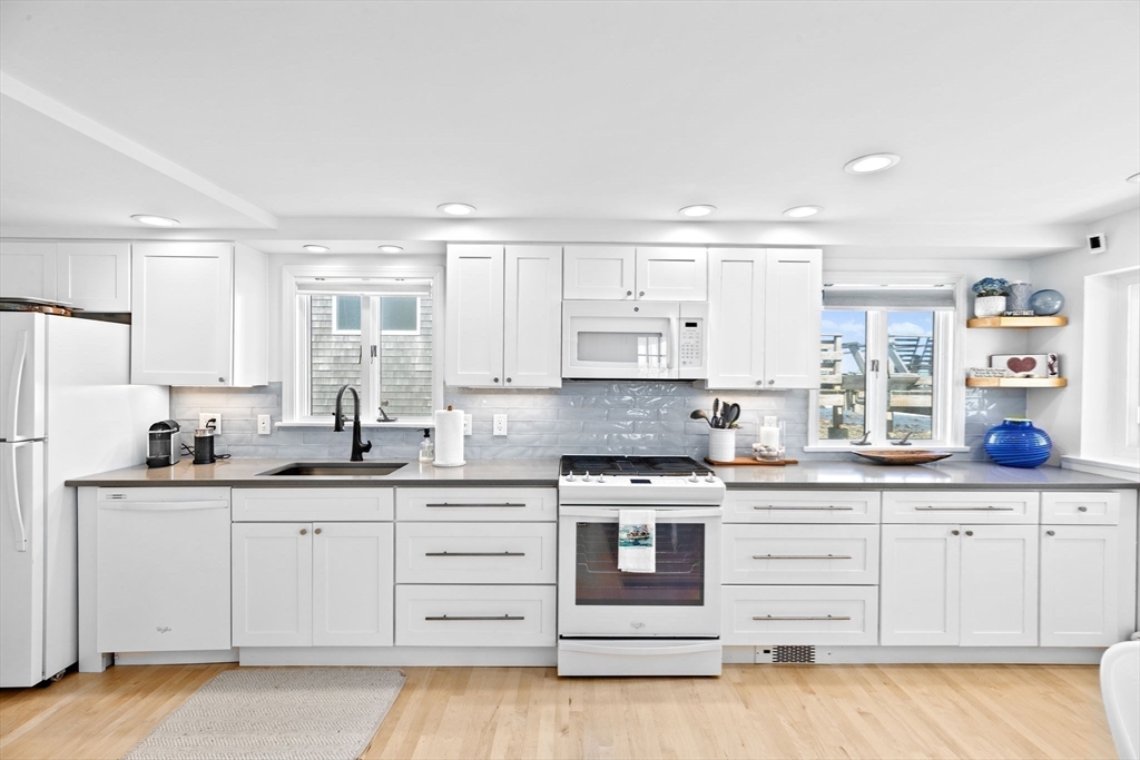 37 Rebecca Road Scituate, MA 02066 - Photo 9 of 18 a kitchen with stainless steel appliances granite countertop a sink and cabinets
