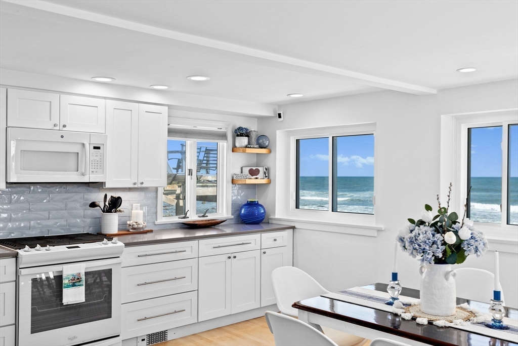 37 Rebecca Road Scituate, MA 02066 - Photo 10 of 18 a kitchen with a stove a sink and a refrigerator