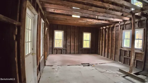 a view of a hallway with windows