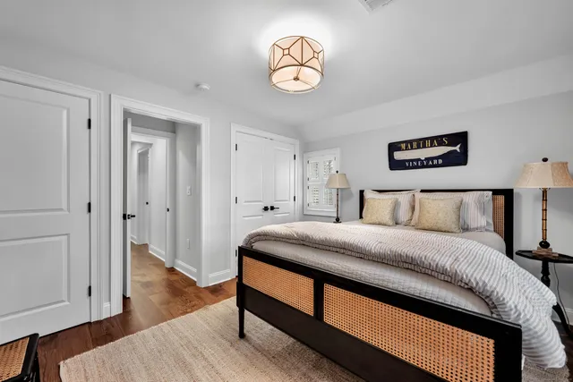 a spacious bedroom with a bed and a window