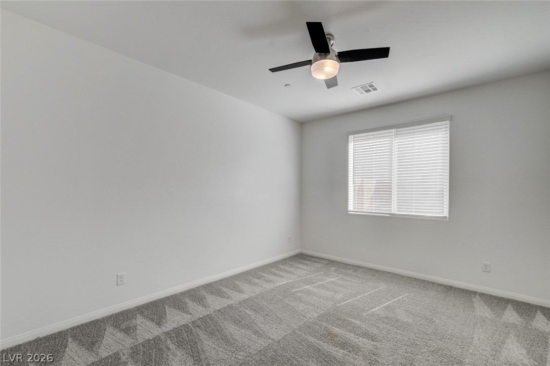 756 Cadence View Way Henderson, NV 89011 - Photo 23 of 45 Unfurnished room with carpet floors and ceiling fan