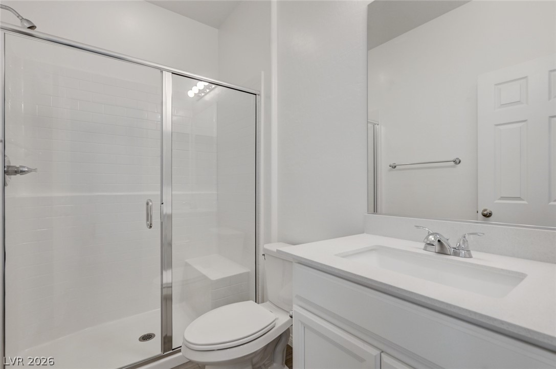 756 Cadence View Way Henderson, NV 89011 - Photo 26 of 45 Full bathroom featuring a shower stall and vanity
