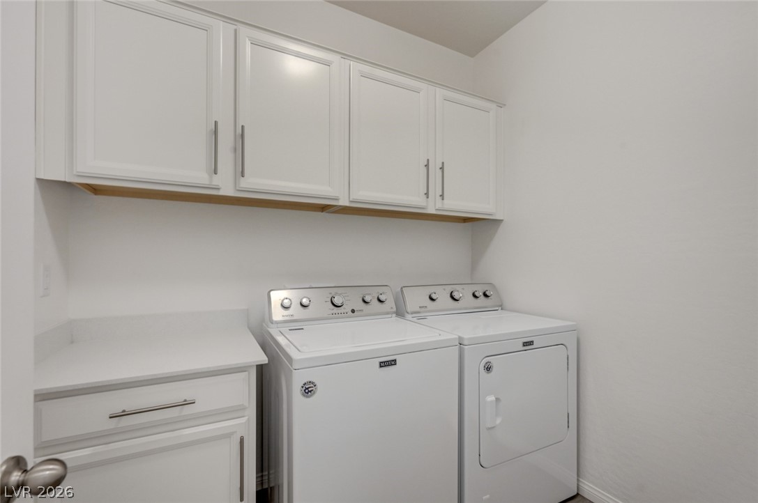 756 Cadence View Way Henderson, NV 89011 - Photo 36 of 45 Laundry room featuring cabinet space and washer and clothes dryer