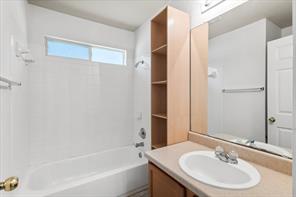 2721 Breezy Point Cove Round Rock, TX 78665 - Photo 16 of 35 a bathroom with a sink and a mirror