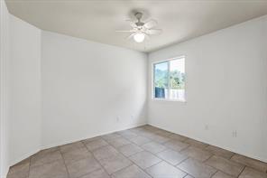 2721 Breezy Point Cove Round Rock, TX 78665 - Photo 17 of 35 an empty room with windows and chandelier fan
