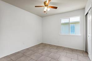 2721 Breezy Point Cove Round Rock, TX 78665 - Photo 20 of 35 an empty room with a window and a fan