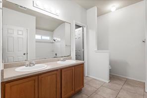 2721 Breezy Point Cove Round Rock, TX 78665 - Photo 25 of 35 a bathroom with a sink and a mirror