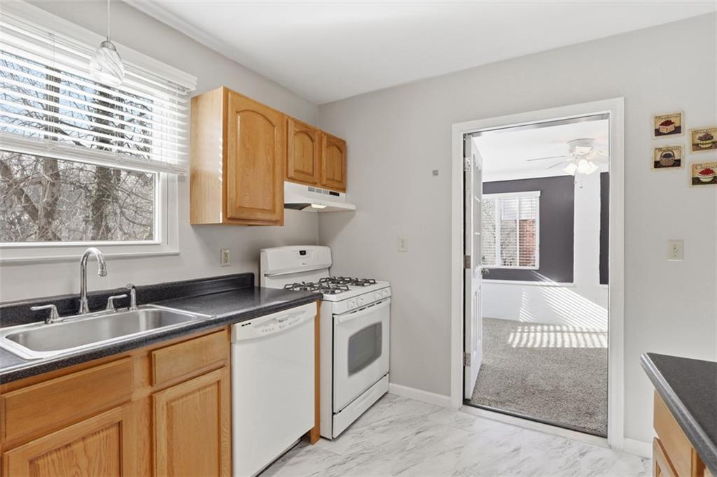 27 Ehle Avenue Coraopolis, PA 15108 - Photo 13 of 44 a kitchen with a sink stove and cabinets
