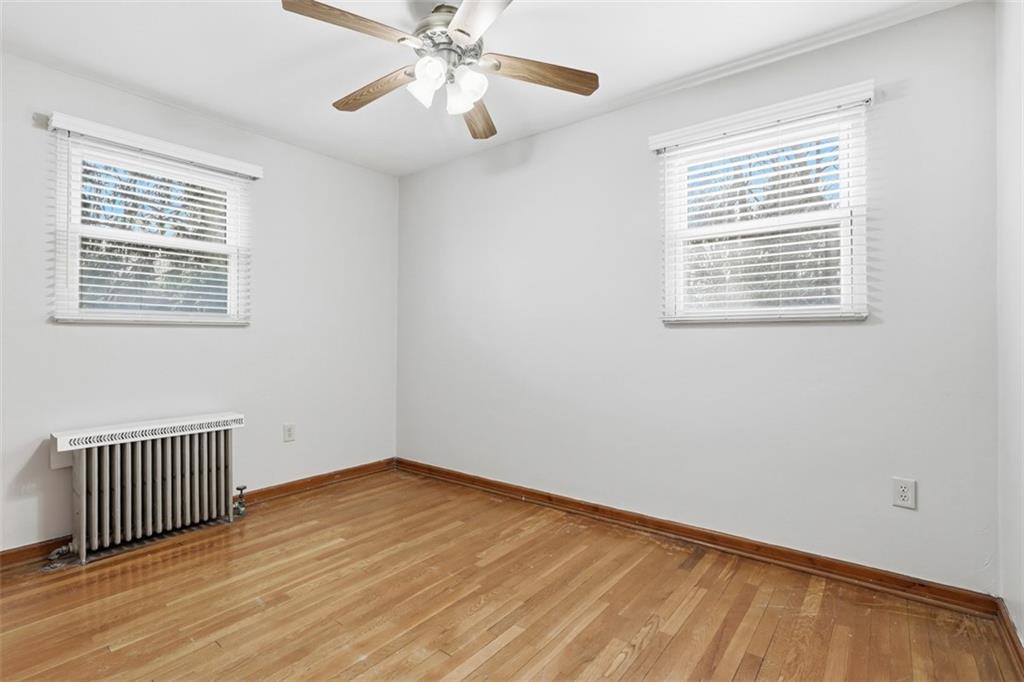 27 Ehle Avenue Coraopolis, PA 15108 - Photo 20 of 44 a view of an empty room with wooden floor and a window