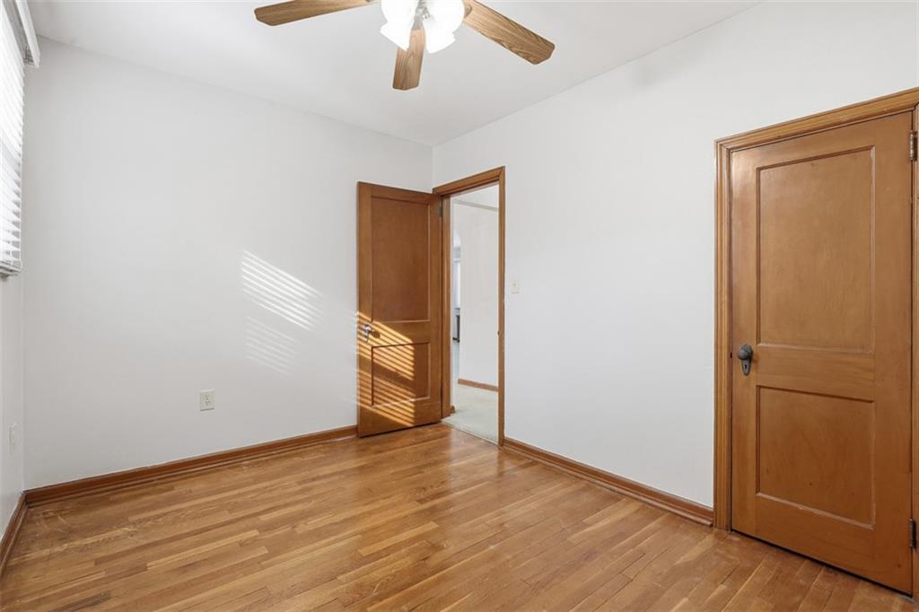 27 Ehle Avenue Coraopolis, PA 15108 - Photo 22 of 44 an empty room with wooden floor closet and windows