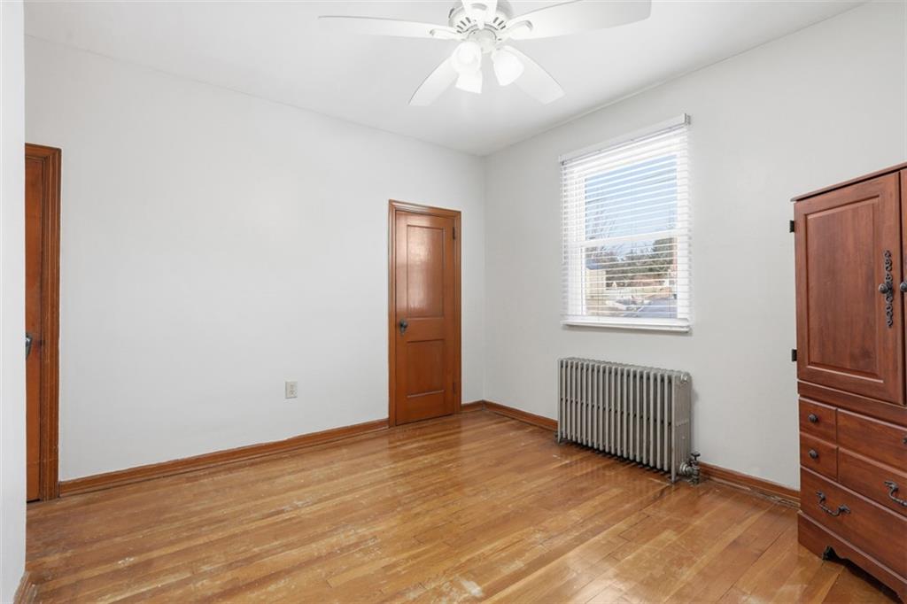 27 Ehle Avenue Coraopolis, PA 15108 - Photo 28 of 44 a view of an empty room with wooden floor and a window