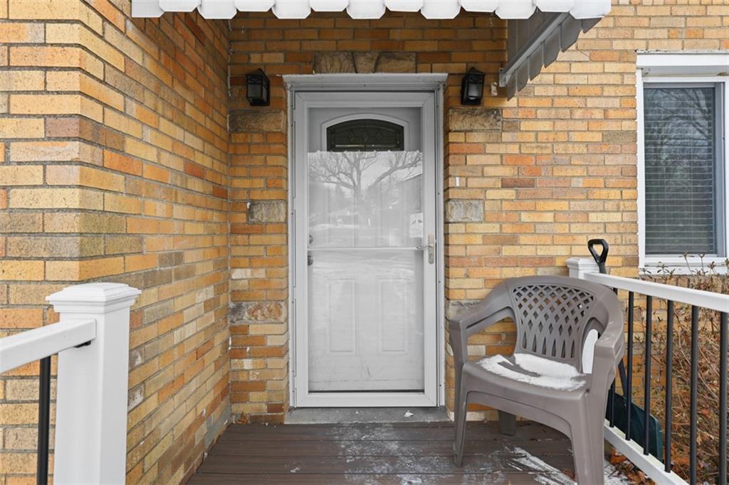 27 Ehle Avenue Coraopolis, PA 15108 - Photo 4 of 44 a view of a door with chair and wooden floor
