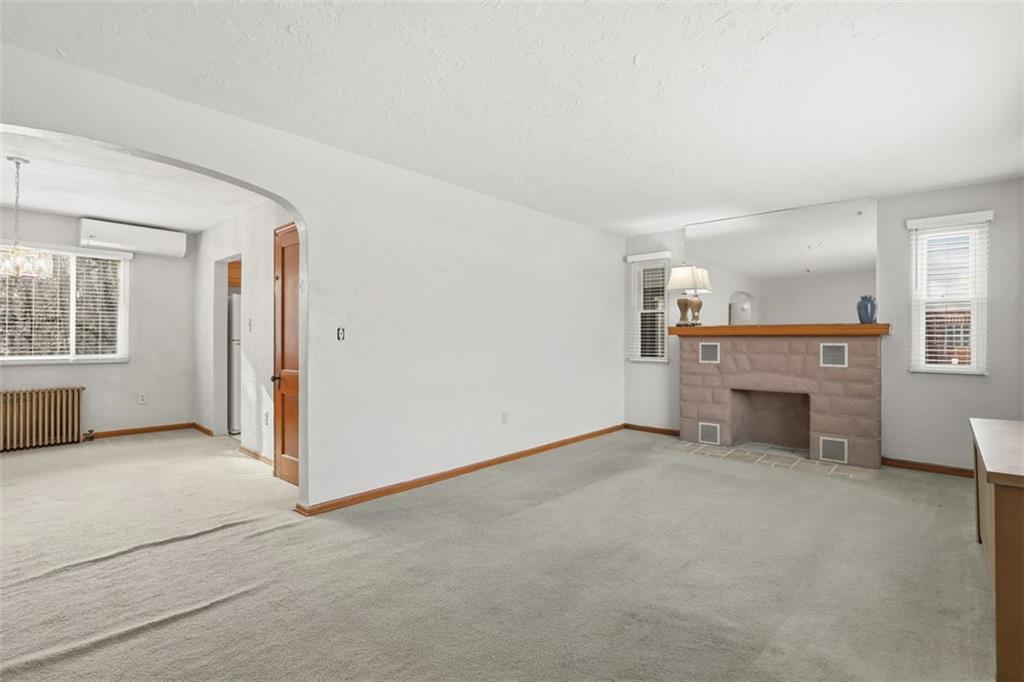 27 Ehle Avenue Coraopolis, PA 15108 - Photo 6 of 44 an empty room with furniture and a fireplace