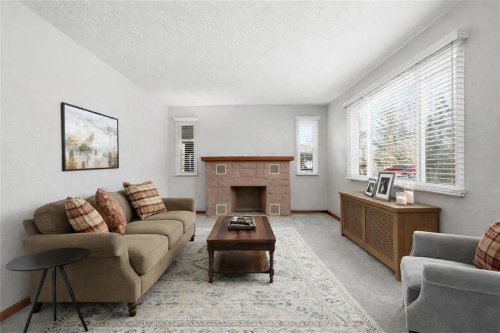 27 Ehle Avenue Coraopolis, PA 15108 - Photo 8 of 44 a living room with furniture and a fireplace