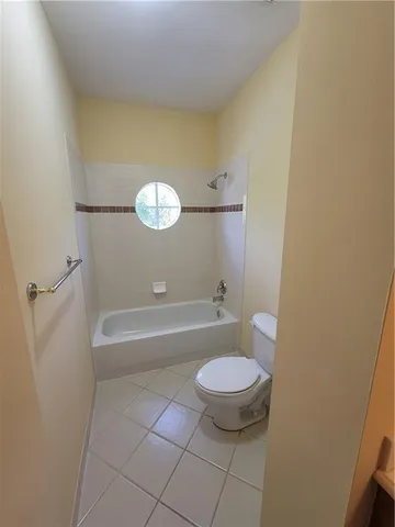 a bathroom with a tub and a sink