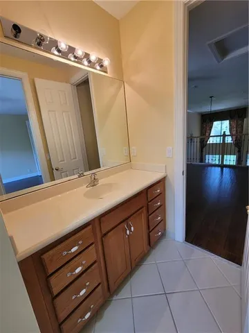 a bathroom with a sink a vanity and a mirror