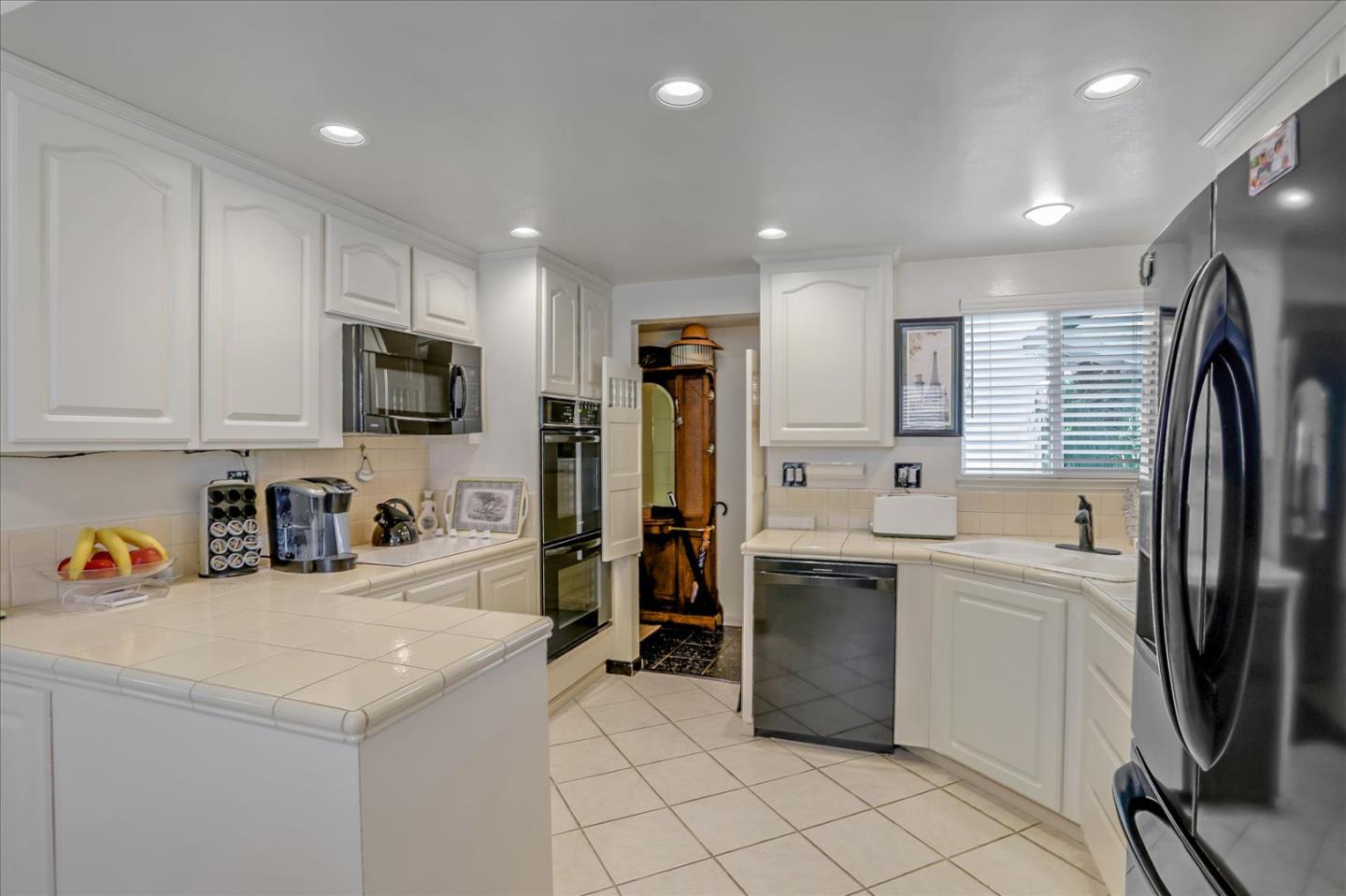 1865 Big Bend Drive Milpitas, CA 95035 - Photo 13 of 40 a kitchen with a sink stainless steel appliances and cabinets
