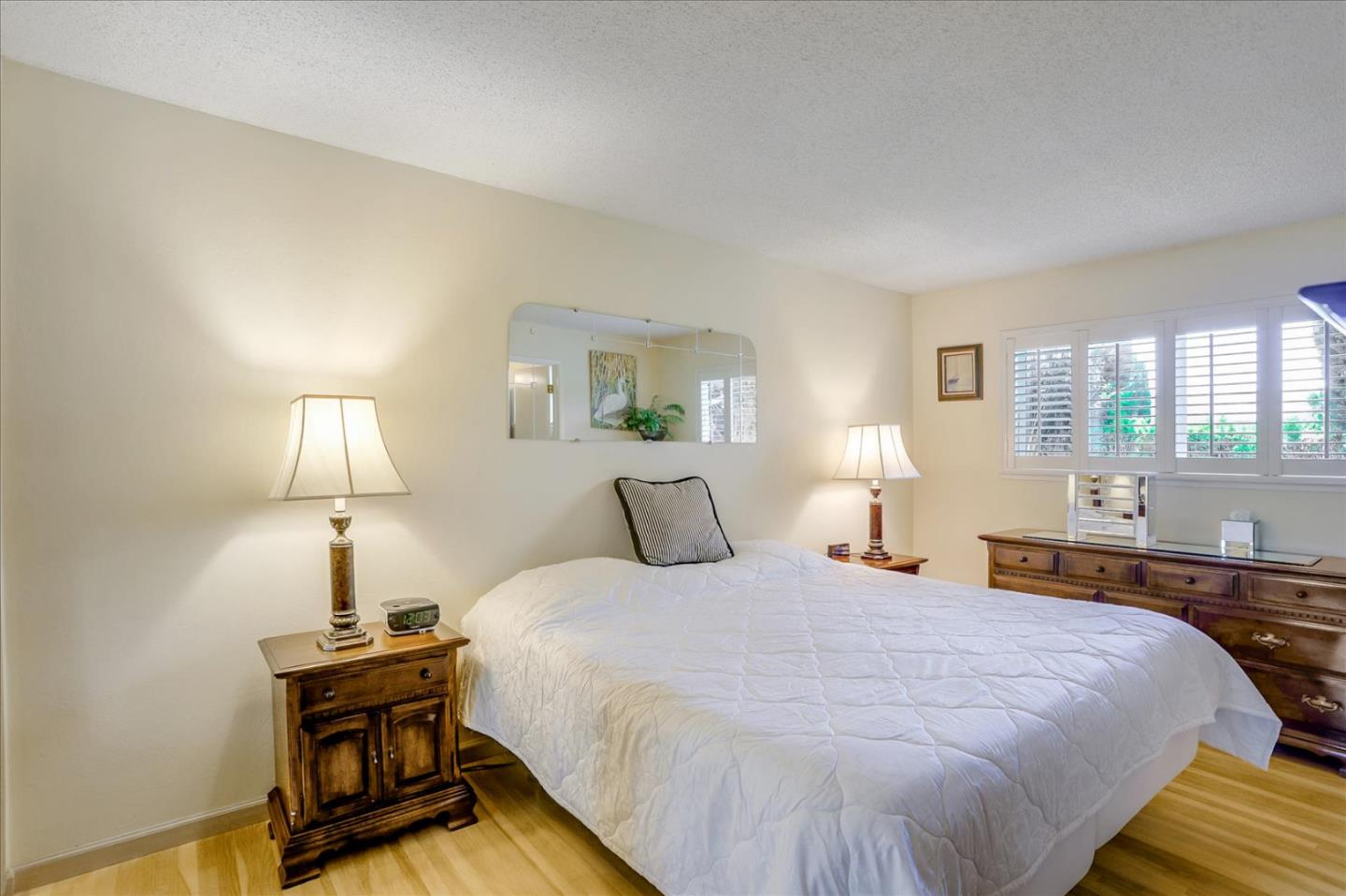 1865 Big Bend Drive Milpitas, CA 95035 - Photo 23 of 40 a bedroom with a bed and a lamp on table