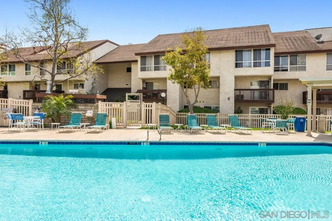 6131 Rancho Mission Road, Unit 323 San Diego, CA 92108 - Photo 11 of 11 a front view of a building with a fountain