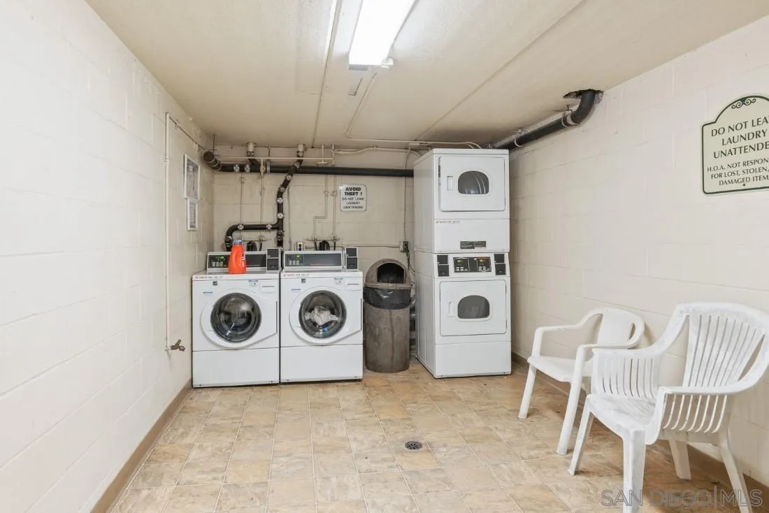 6131 Rancho Mission Road, Unit 323 San Diego, CA 92108 - Photo 10 of 11 a utility room with dryer washer and stair