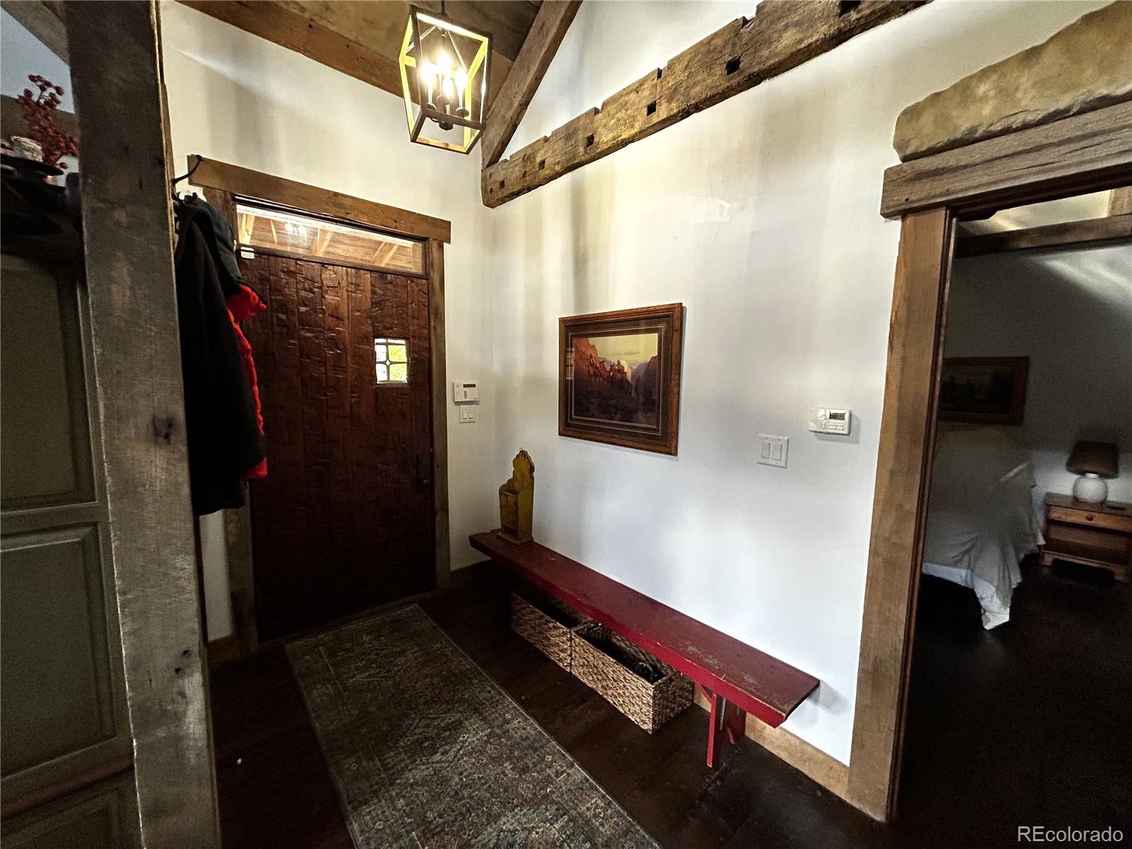 8238 Old San Isabel Road Rye, CO 81069 - Photo 19 of 31 a room with wooden floor and a flat screen tv