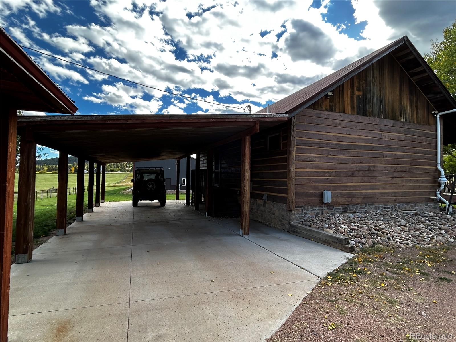 8238 Old San Isabel Road Rye, CO 81069 - Photo 21 of 31 a view of a house with a porch