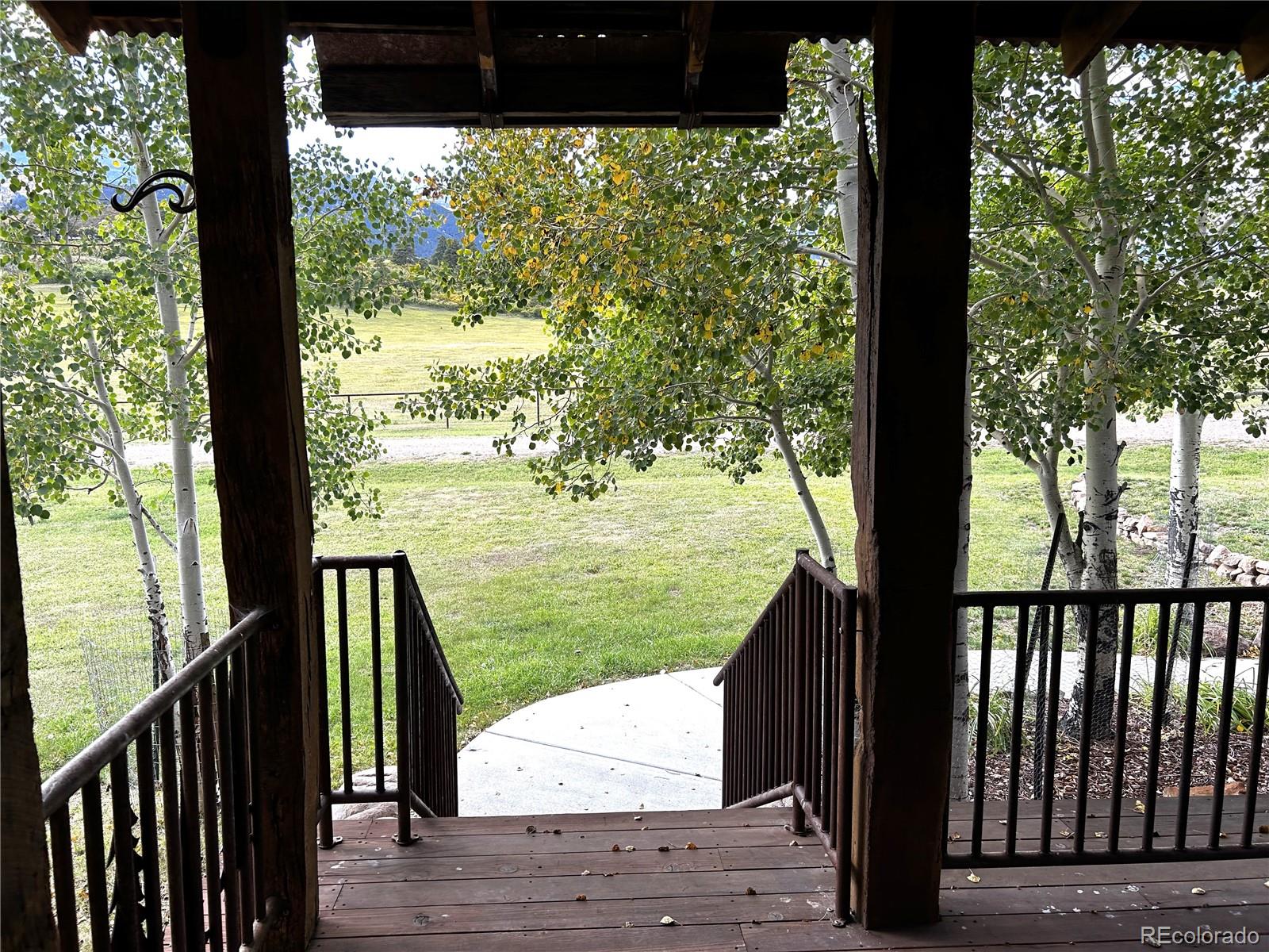 8238 Old San Isabel Road Rye, CO 81069 - Photo 27 of 31 a view of balcony with wooden floor and fence
