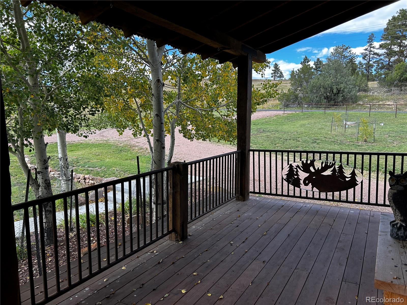 8238 Old San Isabel Road Rye, CO 81069 - Photo 28 of 31 a view of a wooden deck next to a yard