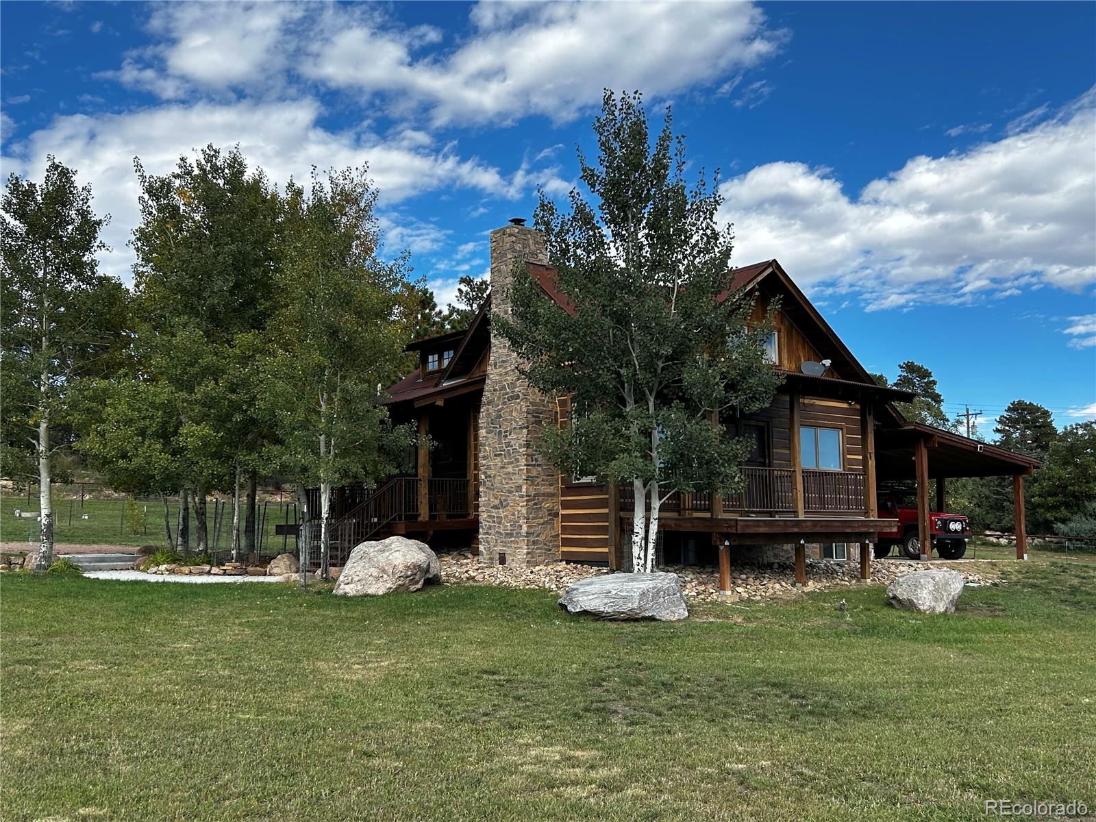 8238 Old San Isabel Road Rye, CO 81069 - Photo 4 of 31 a front view of a house with garden