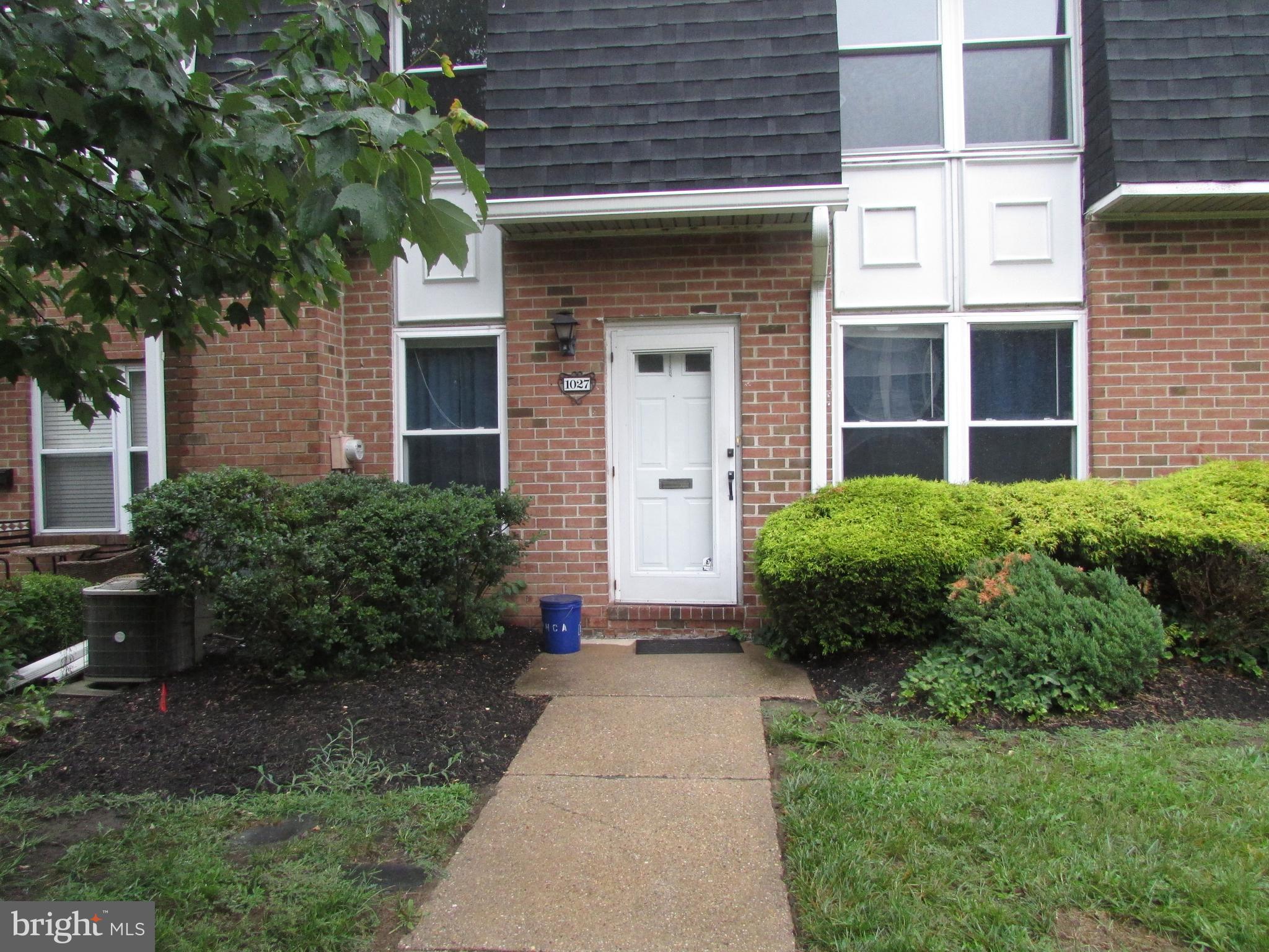 1027 Harbour Drive Palmyra, NJ 08065 - Photo 1 of 16 a view of a house with potted plants and a large tree