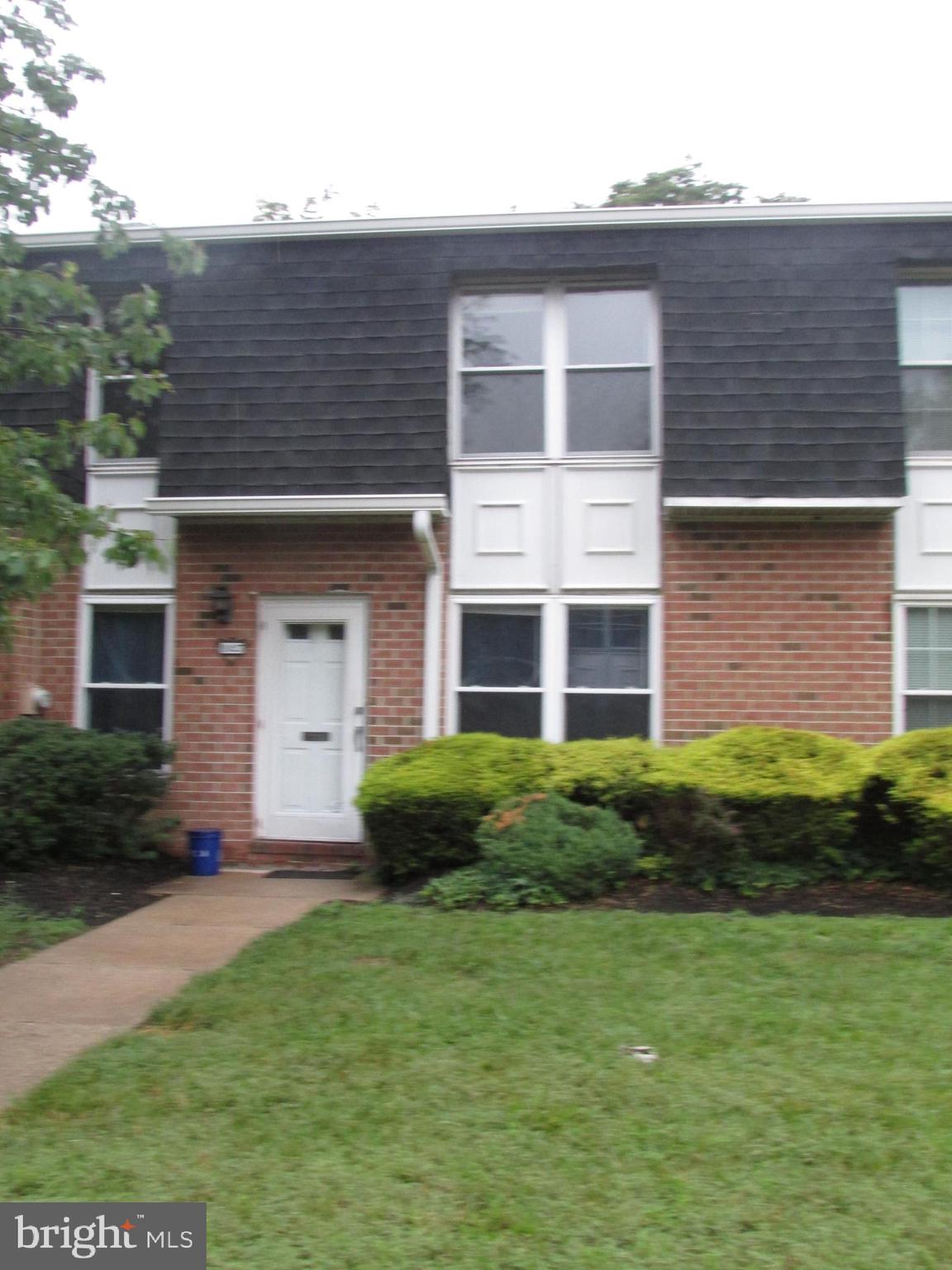 1027 Harbour Drive Palmyra, NJ 08065 - Photo 2 of 16 a front view of a house with garden