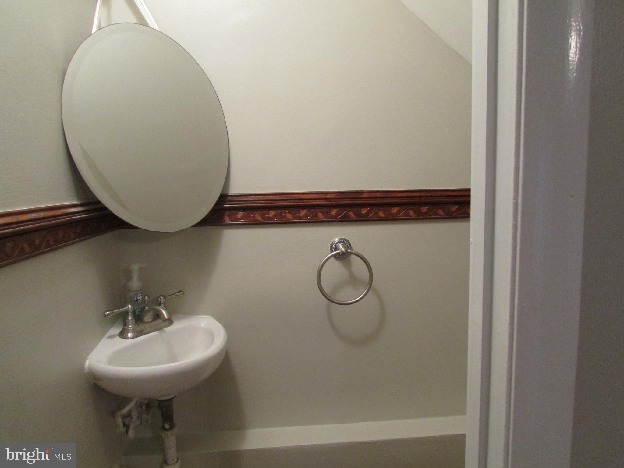 1027 Harbour Drive Palmyra, NJ 08065 - Photo 6 of 16 a bathroom with a sink mirror and toilet