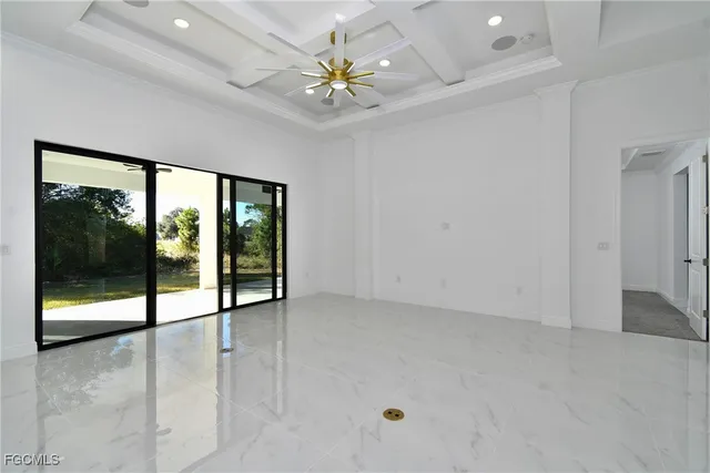a living room with furniture a flat screen tv and a large window