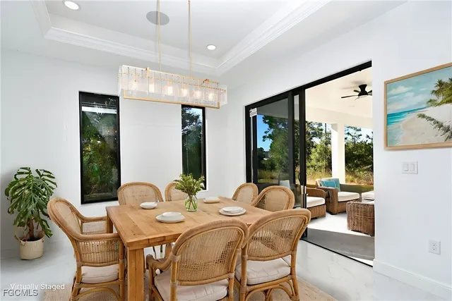 a view of an empty room with glass door and windows