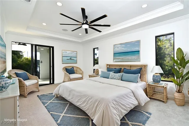 an empty room with ceiling fan and windows