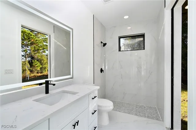 an empty room with a ceiling fan and a ceiling fan