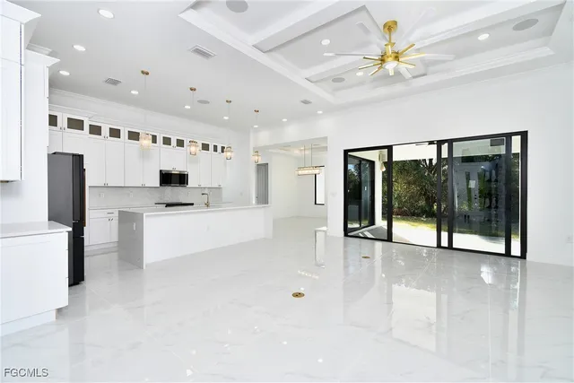 a kitchen with cabinets and window