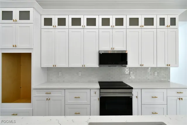 a view of a kitchen with a sink and a large window