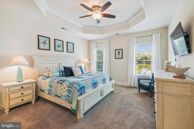 a bedroom with a bed and a lamp