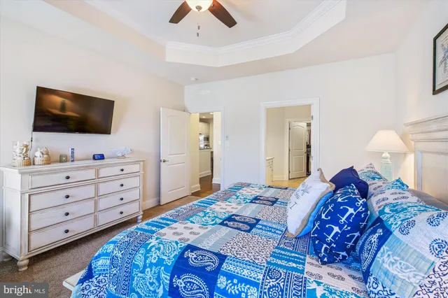 a bedroom with a bed and flat screen tv