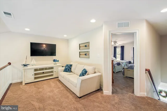 a bathroom with a sink vanity mirror and toilet