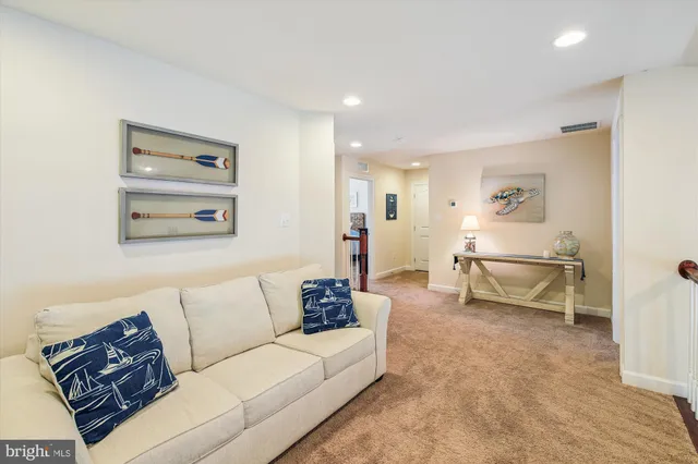 a bathroom with a sink a light fixture and a mirror