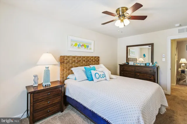 a bedroom with two beds and a window