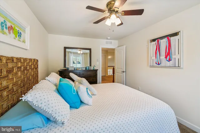 a view of a house with wooden fence