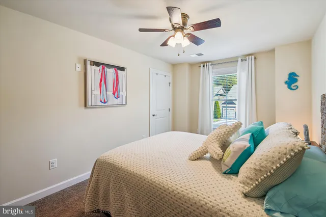 a view of a house with backyard sitting area and garden
