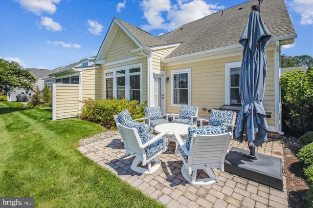 a front view of a building with sitting area