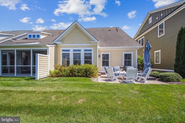 a view of a house with outdoor space and sitting area